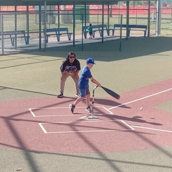 Our young ones playing tee ball