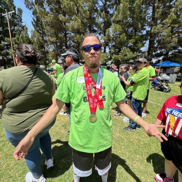 Eric Cole receiving his award for Special Olympics Track and Field competition