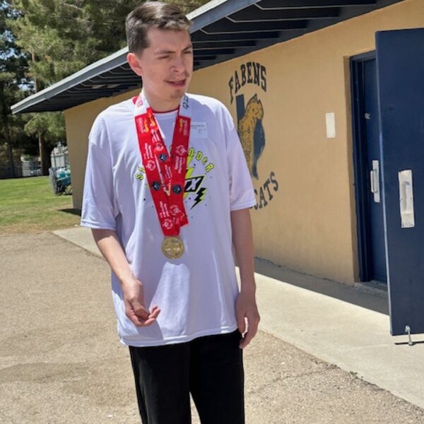 Mauricio receiving his track and field award