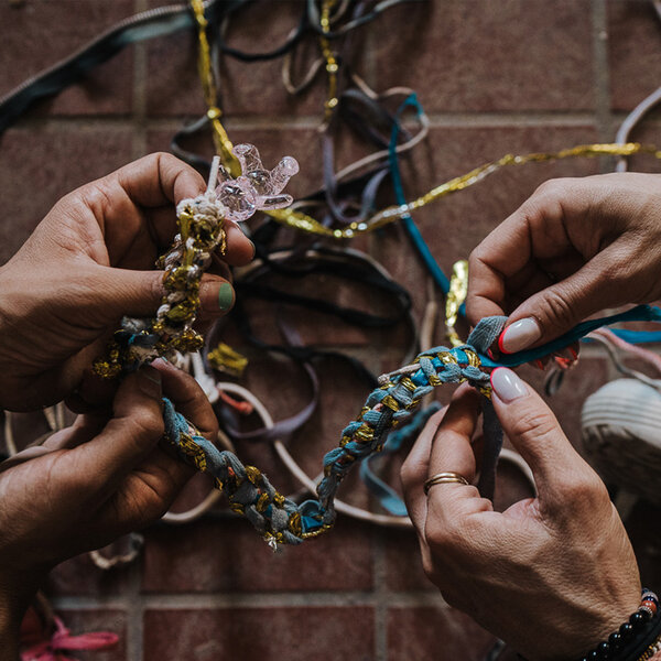 Kids laces found in the desert of Ciudad Juarez, braided into a bracelet that was gifted to Little Amal in her visit to El Paso. 