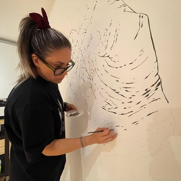 Mabel Weber painting the Hands Mural in Art Gallery of Guelph, ON Canada