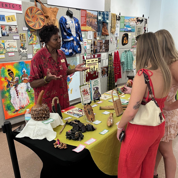 Board Member Cynthia D. Horton telling guests about Sue Koenig's Window to the World: Mobile Museum 