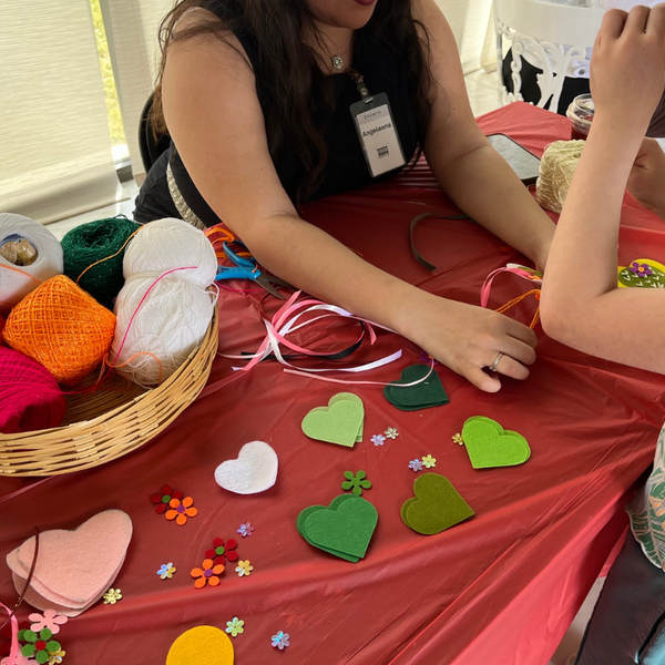 Intern Angleena helping out with a family activity during Vanessa Zavala Clark's Desert Dreamscape Family Day Market