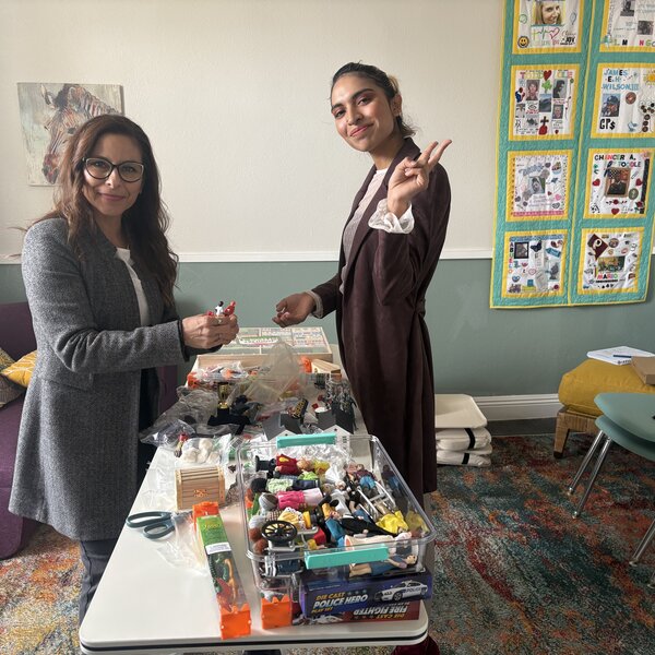 CGC's Director of Clinical Services, Iyali Lara, and Program Specialist Atziri Reyes set up sand therapy stations in one of our five counseling rooms here at Braden's Home of Hope.