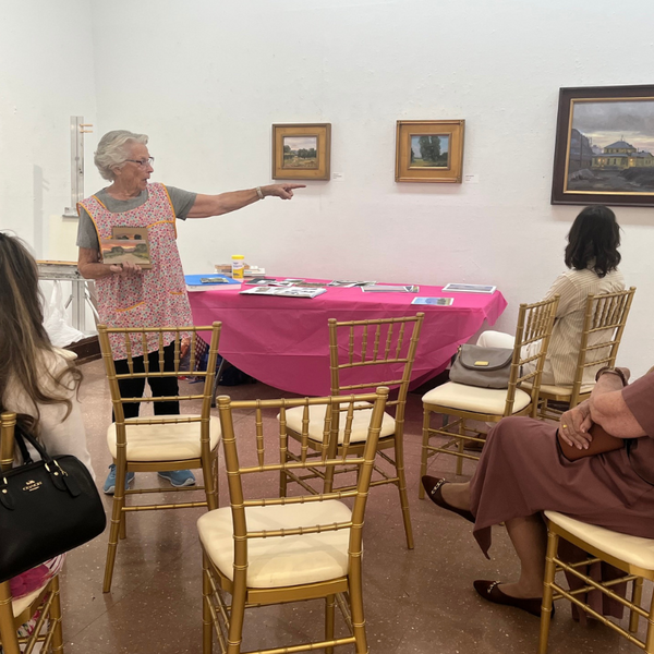 Local artist Nina C. Walker leads a live painting demonstration 