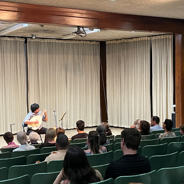 Guests enjoy a free guitar and lute concert by local musician Fernando Escapita
